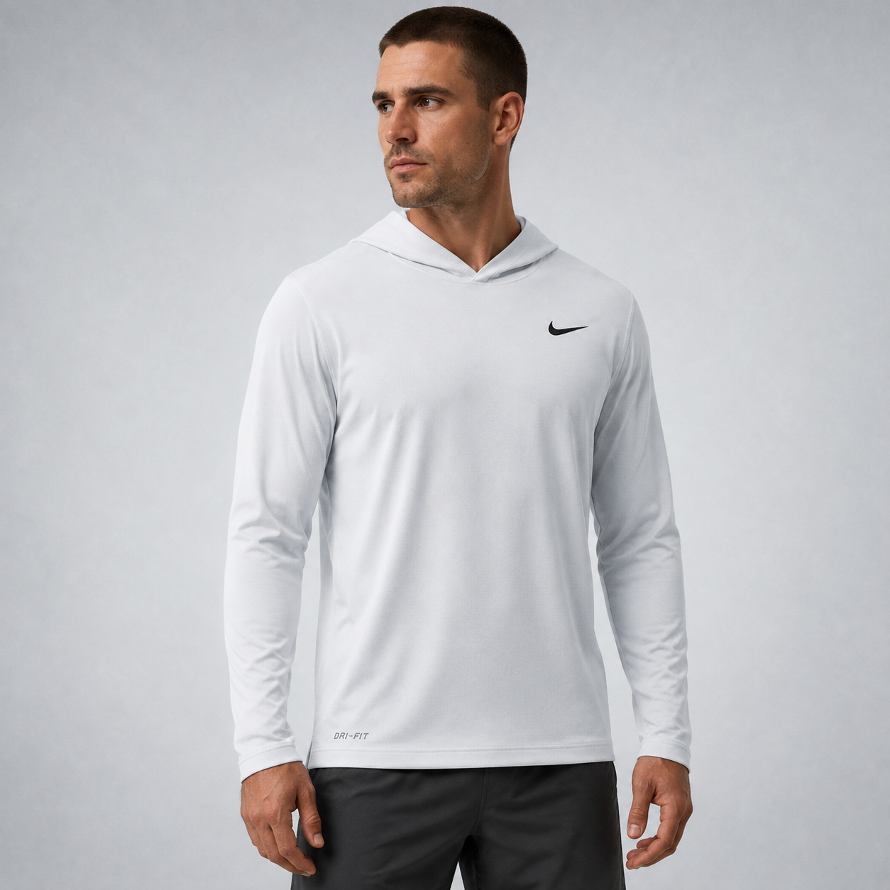 Athletic model wearing the FCTR Apparel Nike Lightweight Hooded Top
