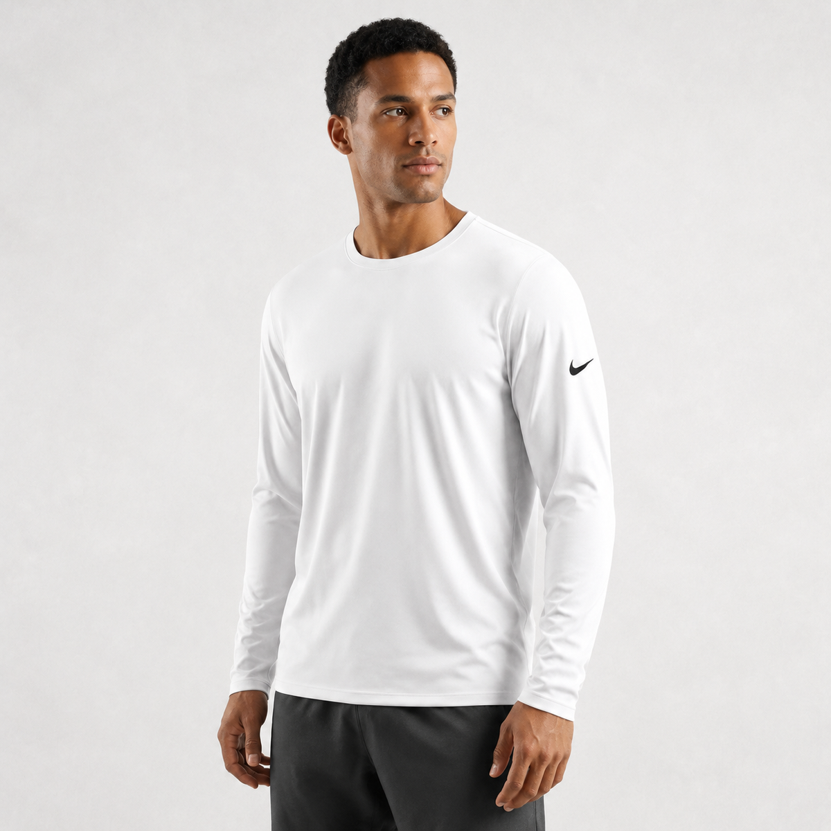 Athletic model wearing the Nike Cotton Long Sleeve Men's Tee
