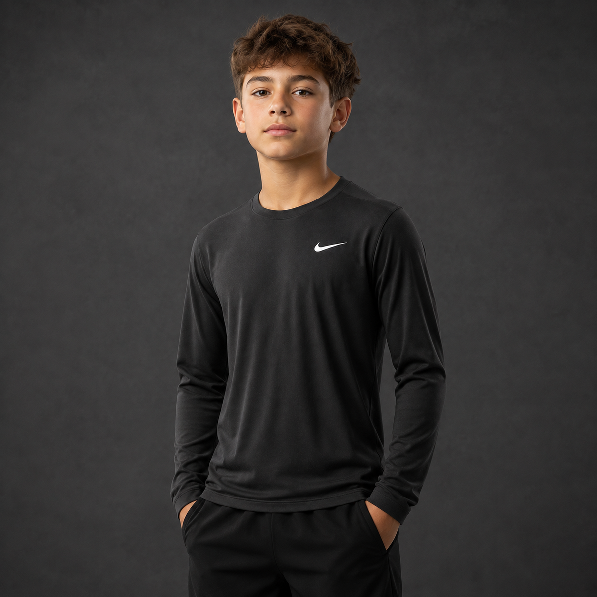 Youth athlete wearing the Nike Youth Dri-Fit Long Sleeve Shirt
