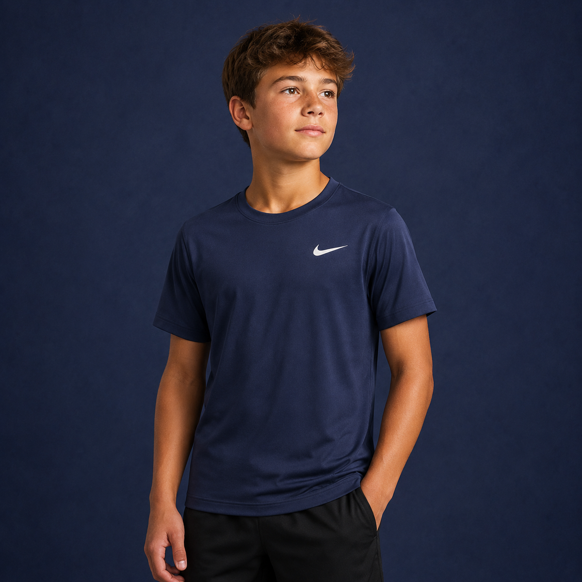Youth athlete wearing the Nike Youth Dri-Fit Short Sleeve Shirt